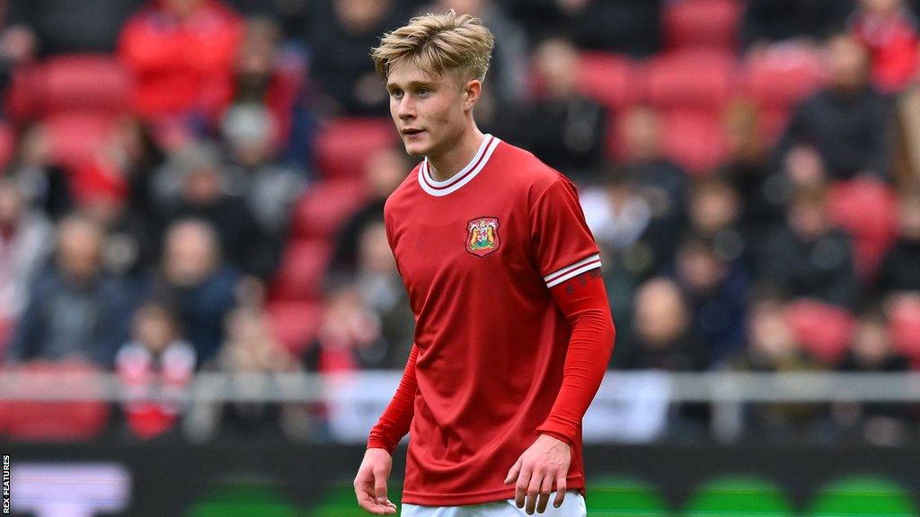 Sam Bell stands on the pitch during Bristol City's defeat by QPR