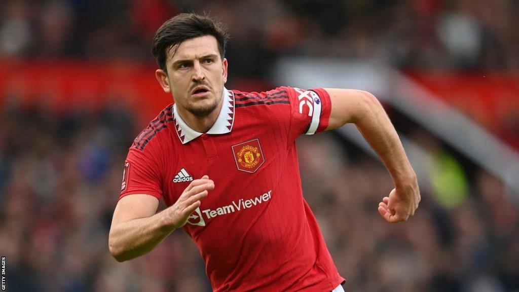 Harry Maguire playing for Manchester United wearing the captain's armband