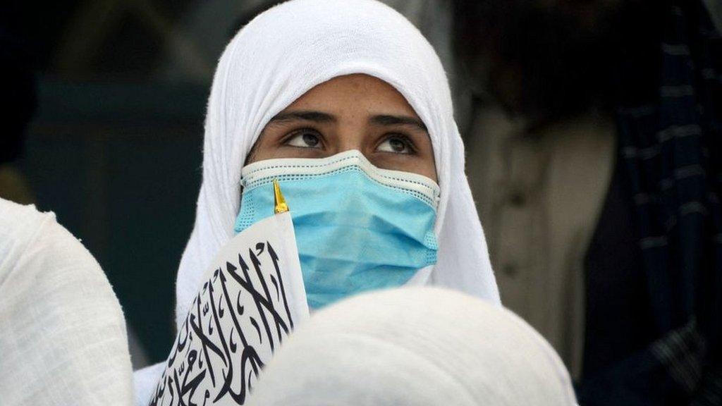 Afghan schoolgirl with flag