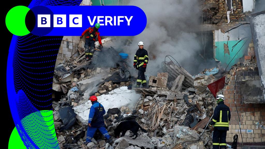 Rescue workers at a bombed building in Kyiv
