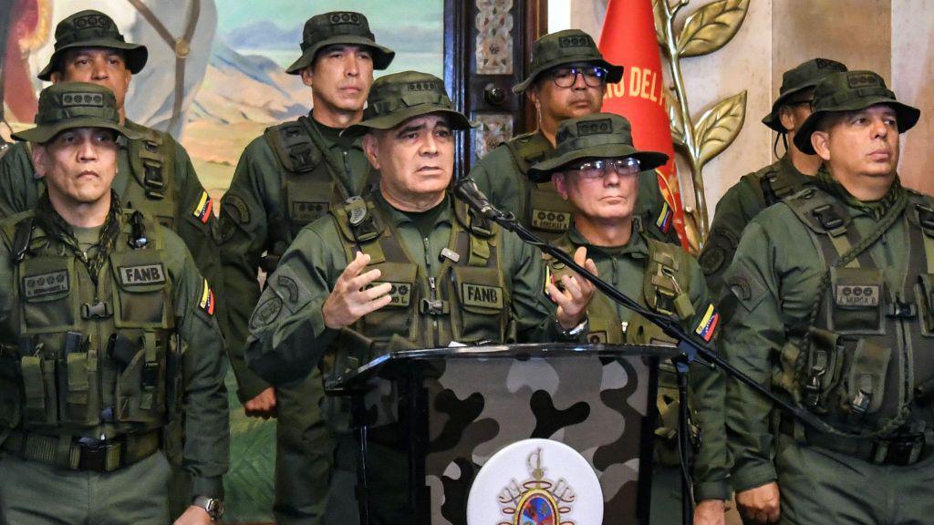 Venezuela's Defence minister Vladimir Padrino Lopez (2nd L) speaks during a press conference in Caracas on July 30, 2024,