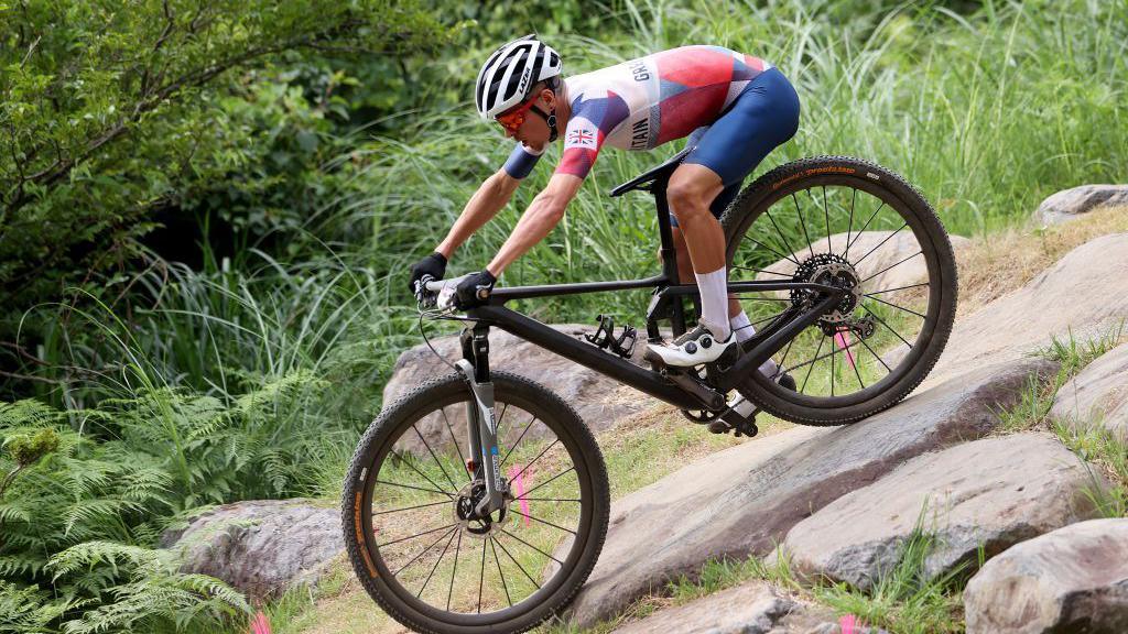 Tom Pidcock competing in the mountain bike at the Tokyo 2020 Olympics