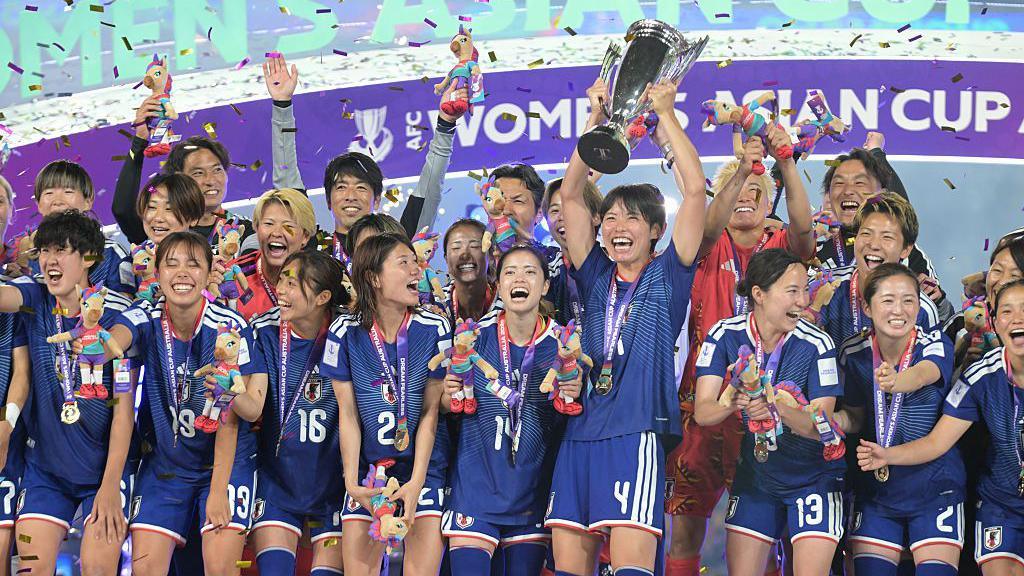Japan players lift the Asian Cup