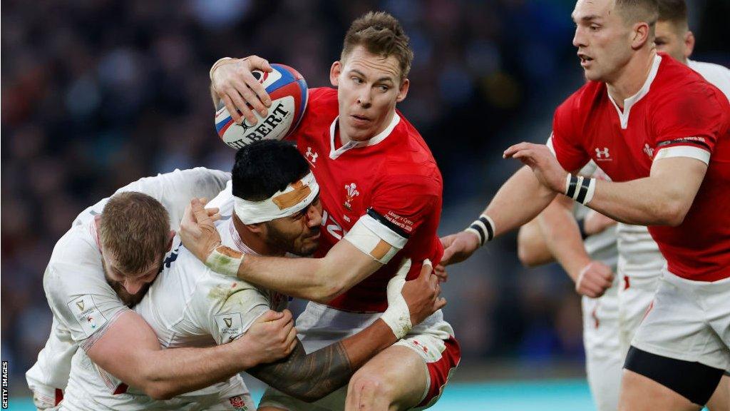 Liam Williams being tackled by England players