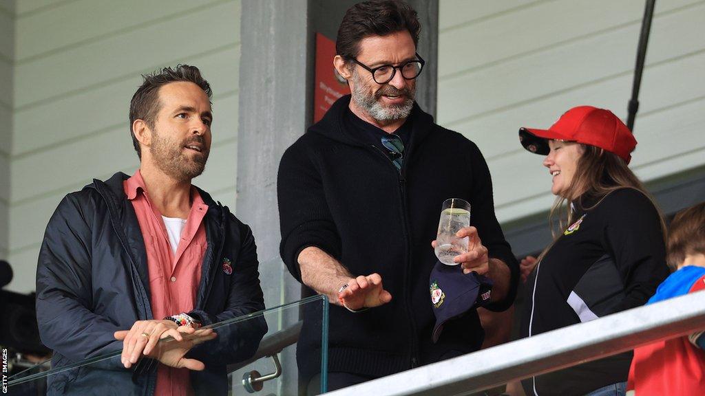 Ryan Reynolds (left) with Hugh Jackman