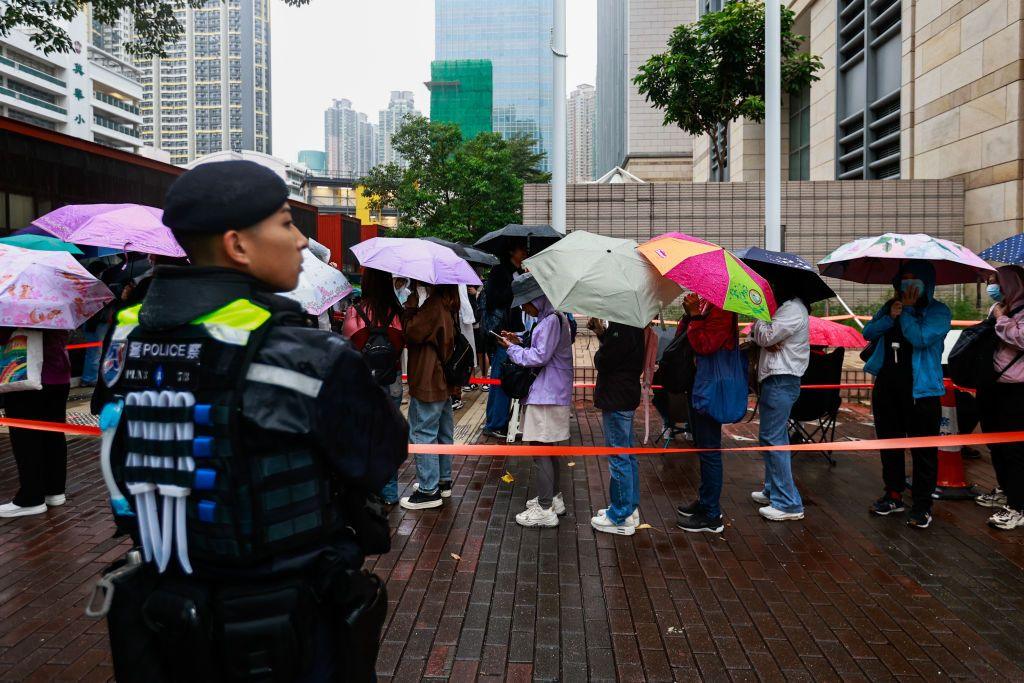 Heavy police presence is seen as huge crowds queue up for public gallery seats, ahead of a sentencing hearing for 45 pro-democracy activists, outside a court in Hong Kong, China, on November 19, 2024. 