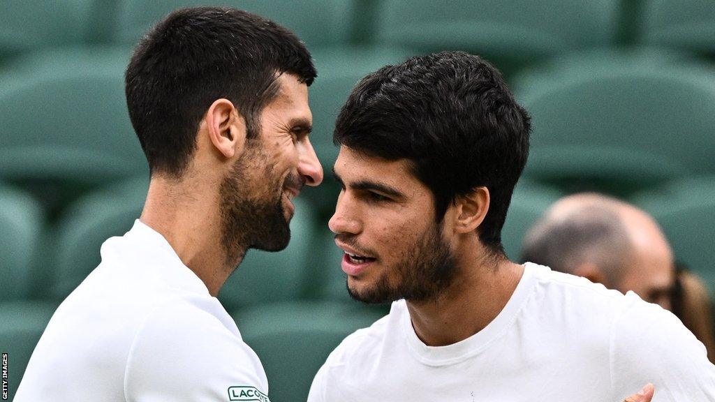 Novak Djokovic hugs Carlos Alcaraz at Wimbledon