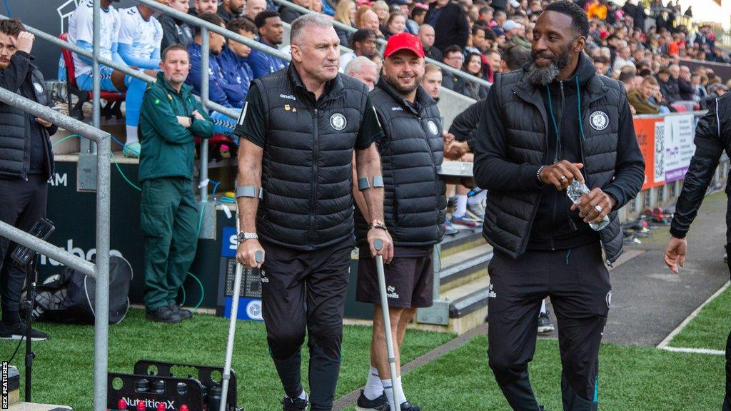 Bristol City manager Nigel Pearson (left) arriving pitchside at Ashton Gate with first-team coach Jason Euell