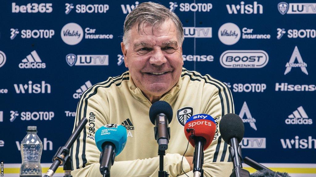 Sam Allardyce smiling at a Leeds news conference