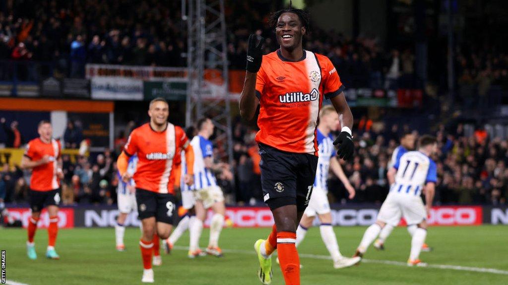 Elijah Adebayo celebrates his hat-trick in Luton's Premier League game against Brighton at Kenilworth Road