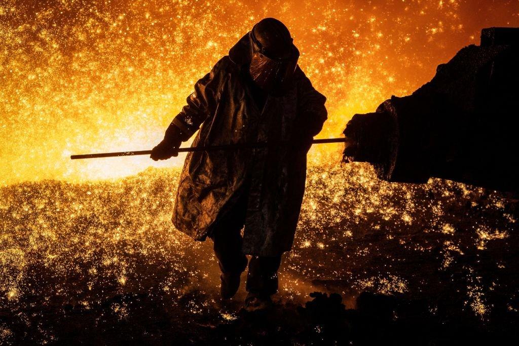 Cast House operator Martin Rees changes the nozzle on a clay gun in Blast Furnace number four at the Tata Steel Port Talbot integrated iron and steel works in south Wales, 15 August, 2023.