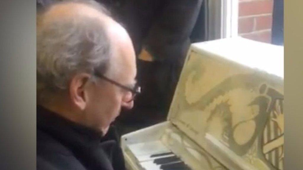 Man playing piano at Clapham Junction