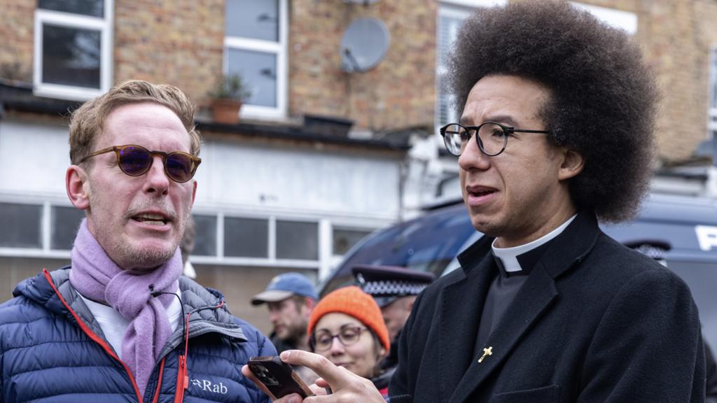 Laurence Fox and Calvin Robinson at a protest