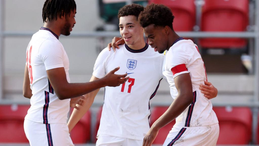 Samuel Edozie, James Balagizi and Carney Chuckwuemeka celebrate goal against Armenia