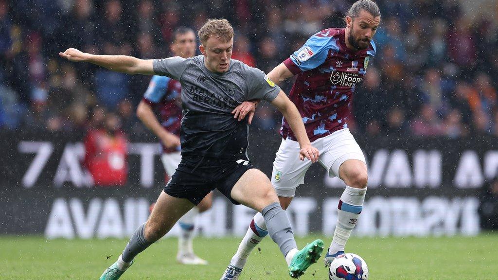 Jay Rodriguez (right) of Burnley holds off a challenge from Eli King of Cardiff City