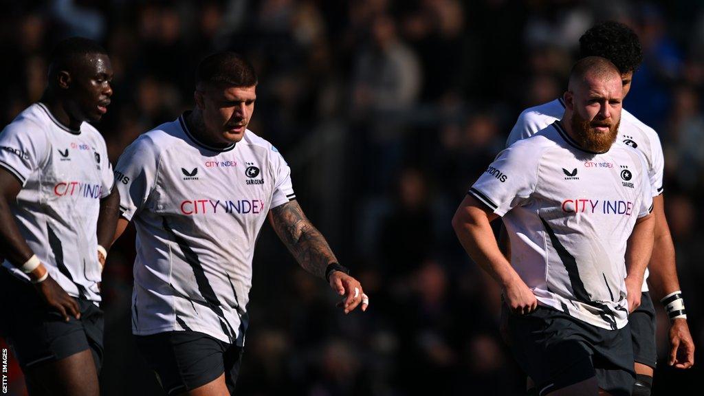 Saracens players look stunned after Exeter score their seventh try