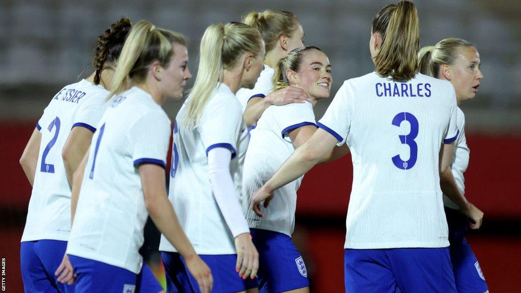 Grace Clinton is congratulated after scoring