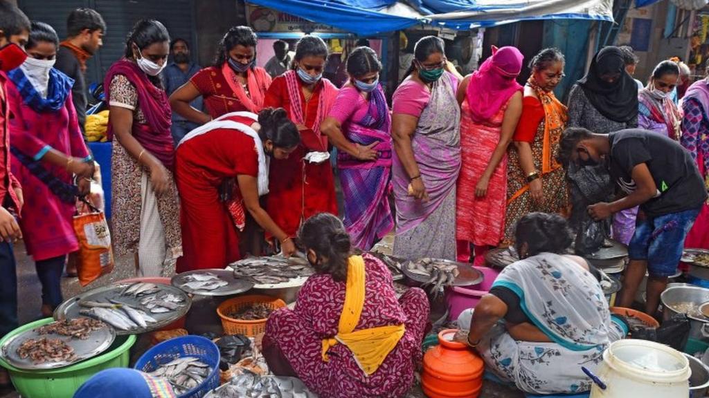 A crowd gathers in Mumbai, India