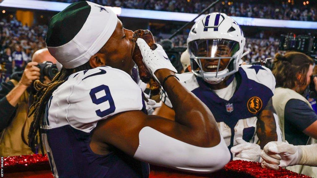 DaRon Bland eats a turkey leg after scoring a touchdown during the Dallas Cowboys' 2023 Thanksgiving game