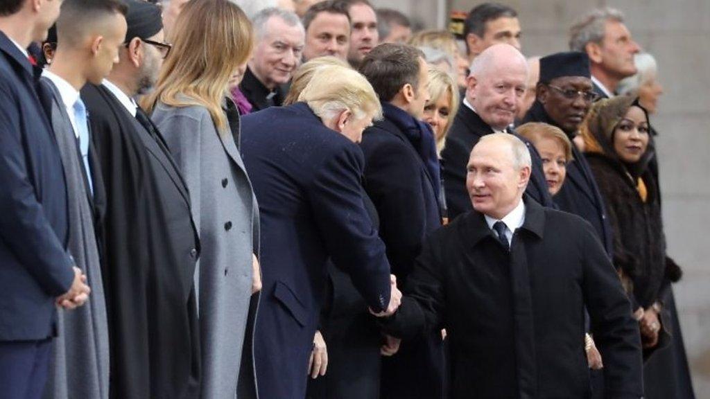 President Trump and President Putin shake hands