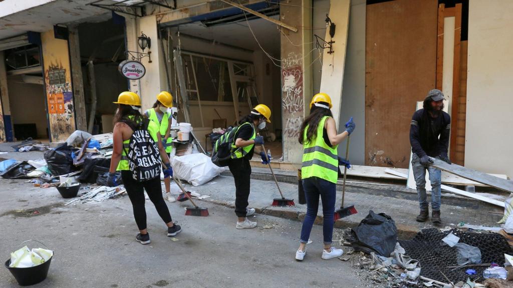 Volunteers clean debris following Tuesday's blast in Beirut's port area, Lebanon August 7, 2020