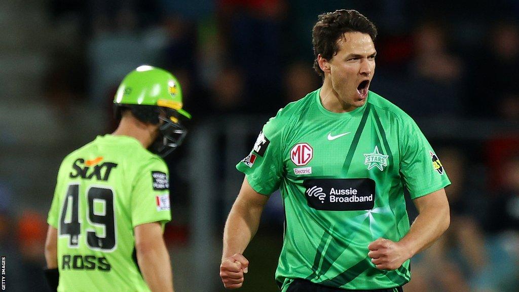 Nathan Coulter-Nile of the Stars celebrates taking a wicket during the Men's Big Bash League match between the Sydney Thunder and the Melbourne Stars at Manuka Oval, on December 13, 2022, in Canberra