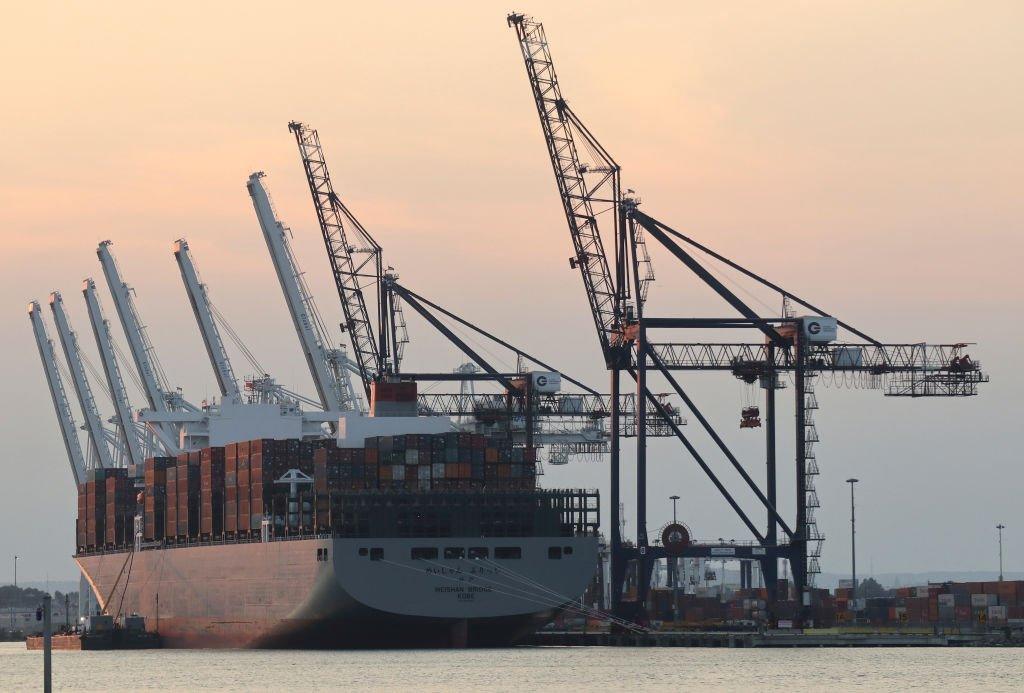 A lot container ship docking at port