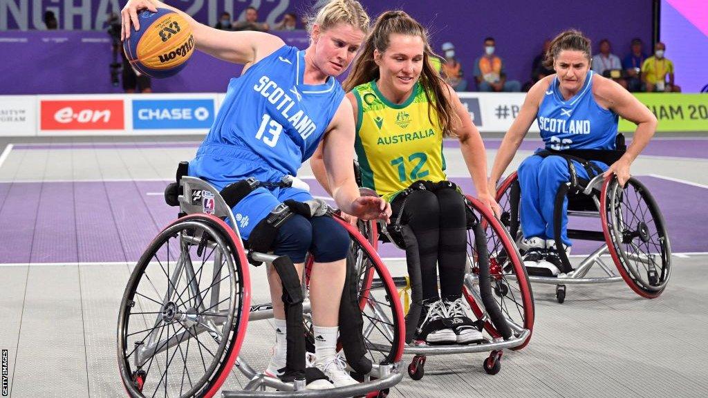 Scotland's Robyn Love holds off Australia's Georgia Inglis during the 2022 Commonwealth Games wheelchair basketball tournament