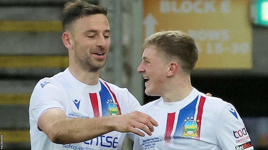 Rhys Annett (right) celebrates scoring Linfield's third goal against Portadown