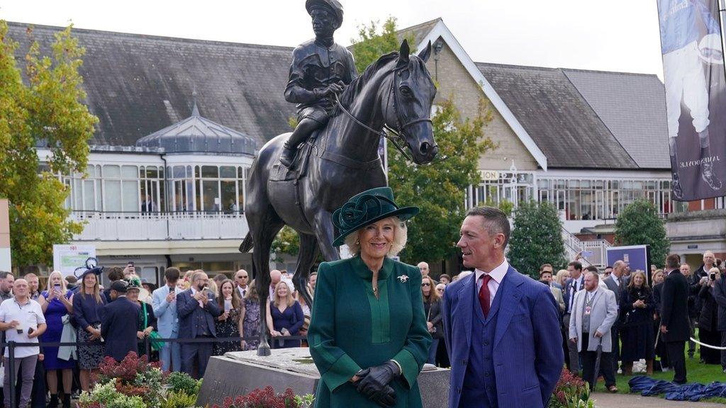 Queen Camilla and Frankie Dettori with statue at Ascot Racecourse