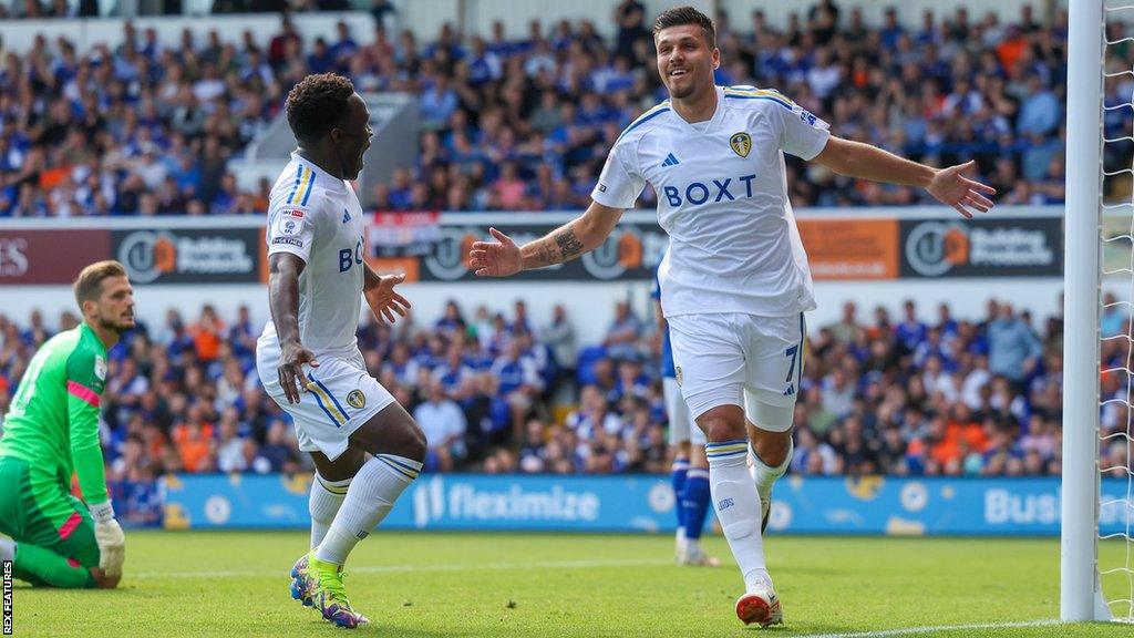 Joel Piroe (right) wheels away in celebration after scoring for Leeds United against Ipswich Town