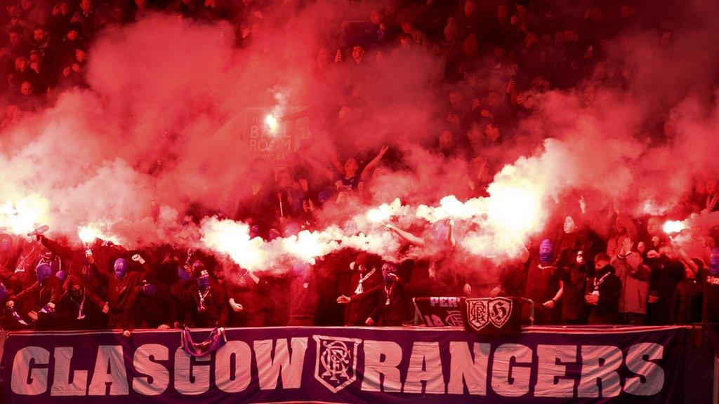 Rangers fans let off pyrotechnics in the away end at Easter Road