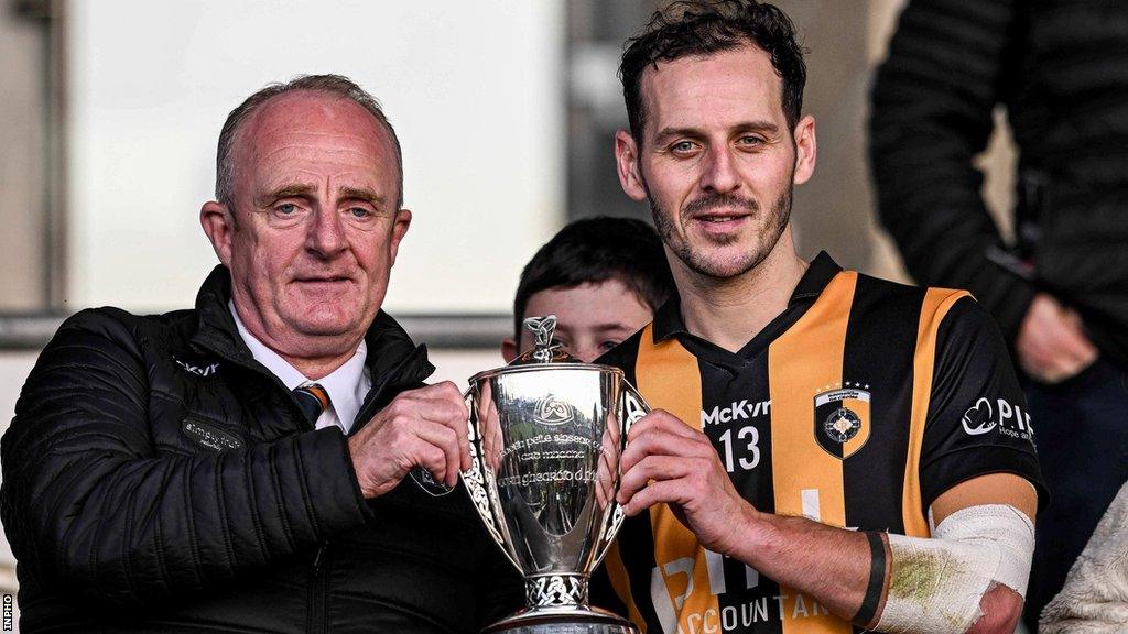 Captain Jamie Clarke is presented with the Gerry Fagan Cup after Crossmaglen's Armagh Final win over Clan na Gael