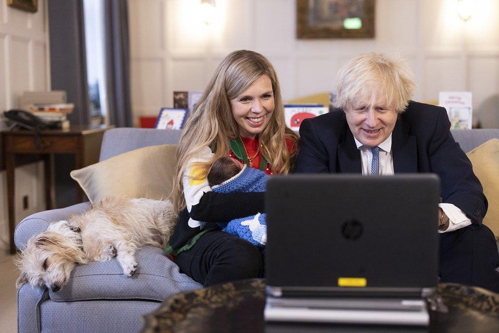 Prime Minister Boris Johnson and his wife Carrie Johnson, with their daughter Romy, hold video calls from Chequers, 23 December 2021