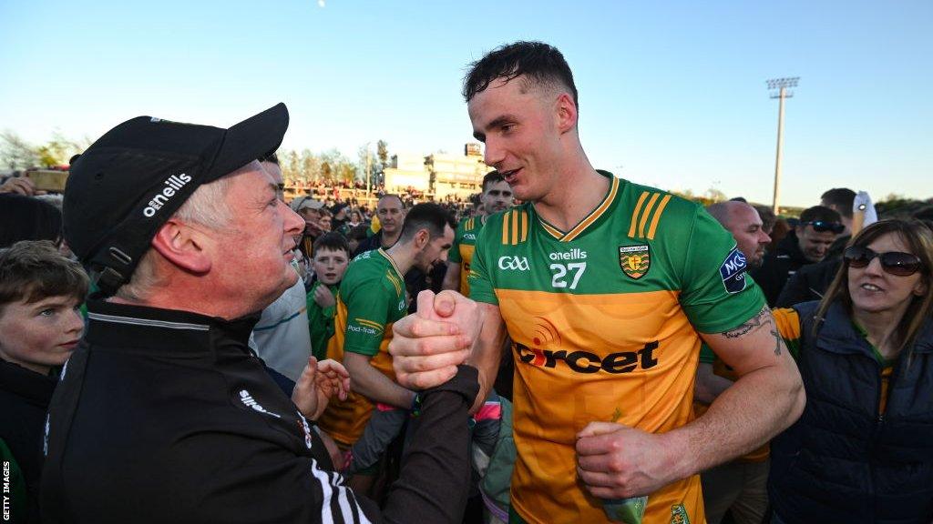 Jason McGee celebrates with a fan