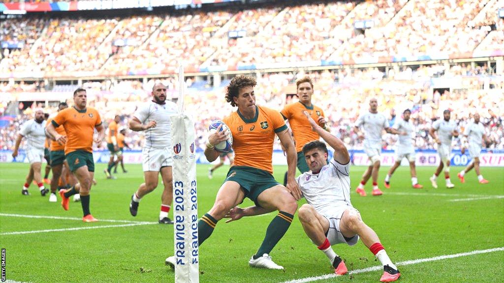 Mark Nawaqanitawase steps inside a Georgian tackler to score