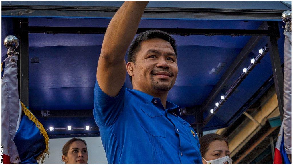 Manny Pacquiao raises his hand in salute during presidency campaign, 2022