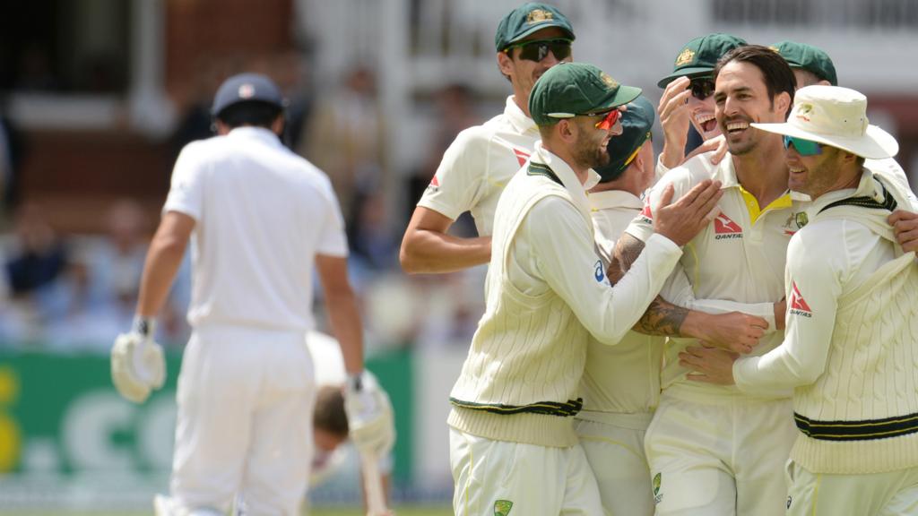 Australia players celebrate the wicket of Alastair Cook