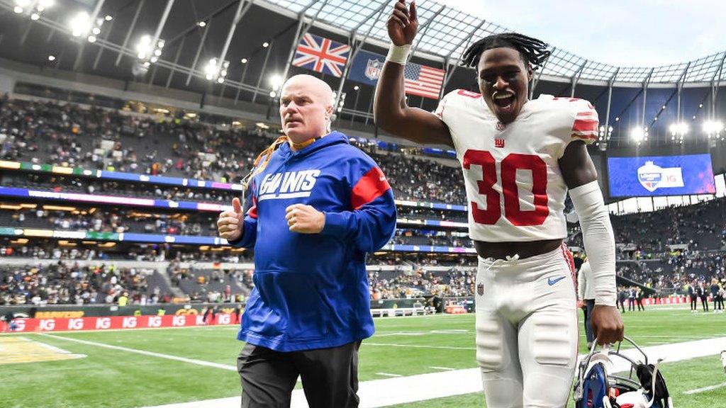 Darnay Holmes celebrates