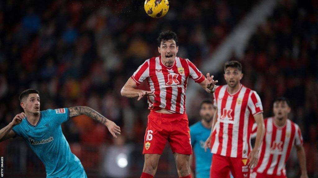 Almeria's Aleksandar Radovanovic heading the ball