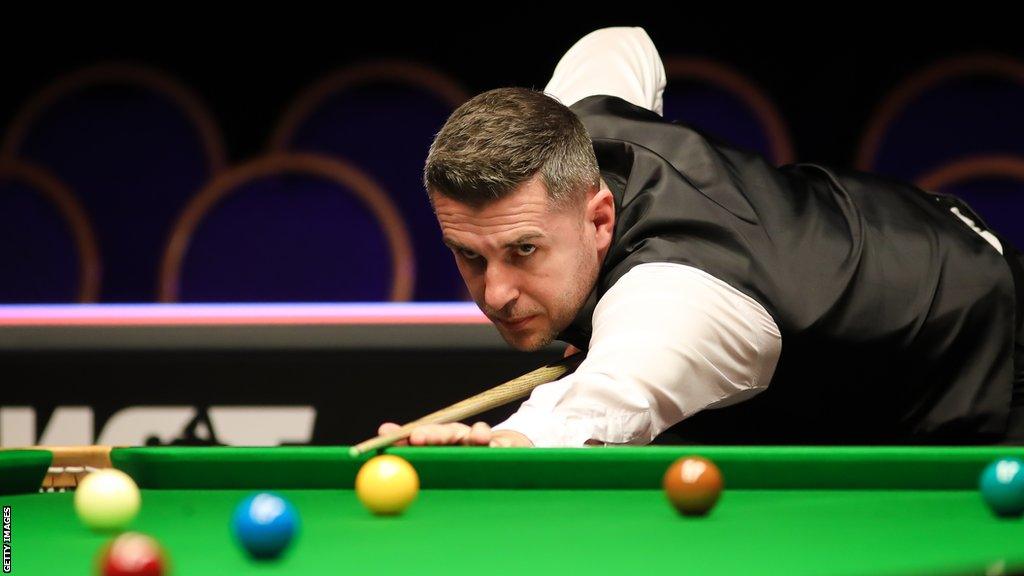 Mark Selby playing a shot