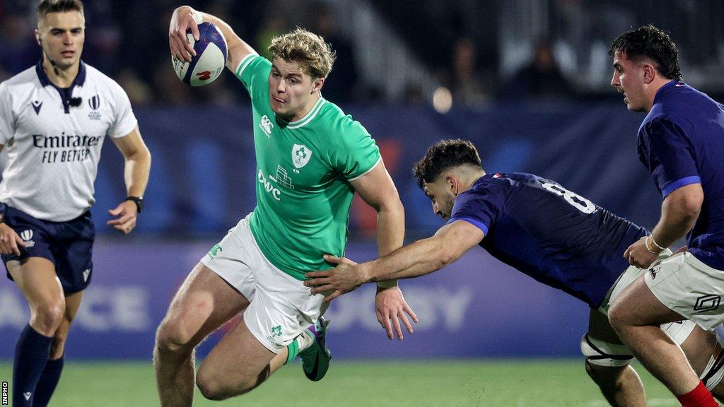 Ireland's Hugh Gavin is tackled by France's Mathis Castro