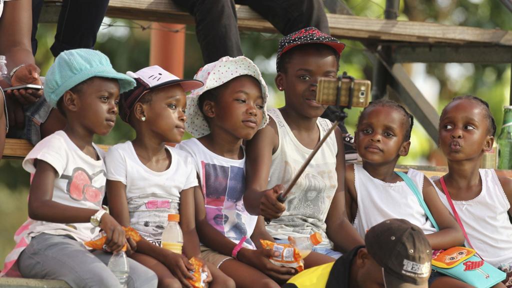 Children taking a selfie in Harare, Zimbabwe