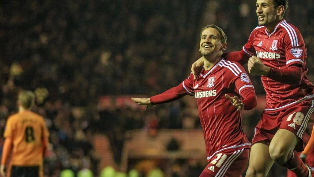 Gastón Ramiez and Christian Stuani celebrate the opening goal