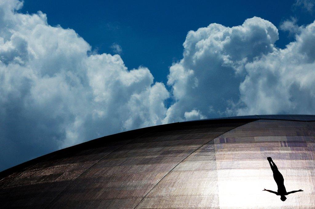 A diver practises before the women's high diving preliminaries at the World Aquatics Championships in Fukuoka, Japan