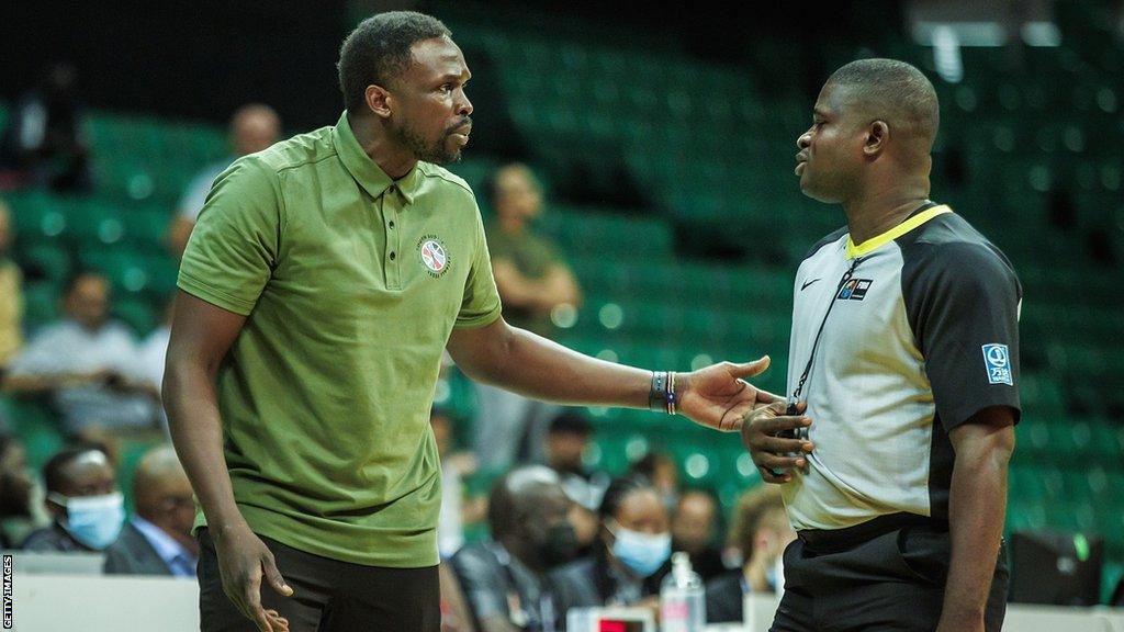 Luol Deng talks to a referee