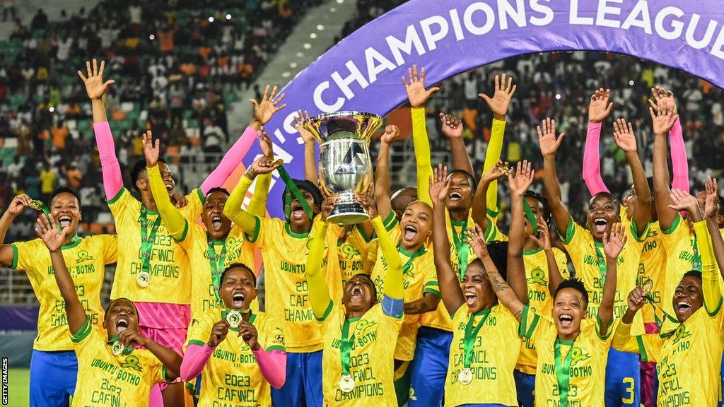 Mamelodi Sundowns players lift the Women's African Champions League trophy after beating Sporting Club Casablanca in Ivory Coast