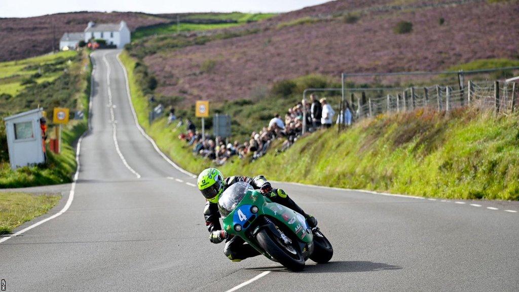 Victor Lopez racing through a corner during the Junior Manx GP