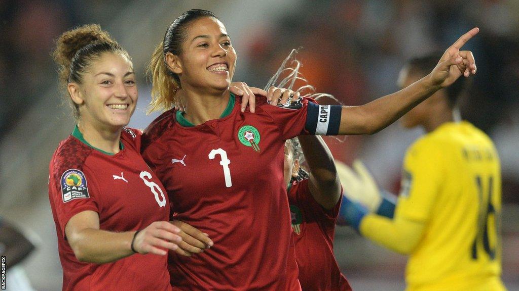 Morocco's Ghizlane Chebbak celebrates a goal with a team-mate