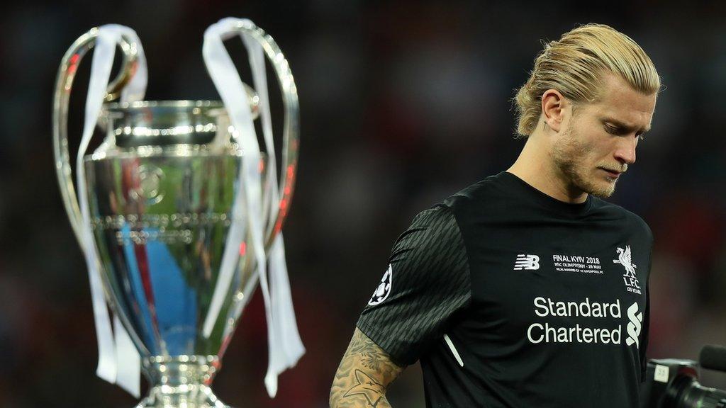 Loris Karius walks past the Champions League trophy after the 2018 final